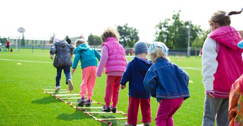 Kids - Children's Team Building on Green Grassland