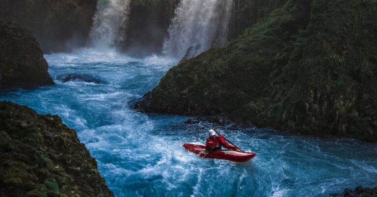 Kayak - Person on Watercraft Near Waterfall