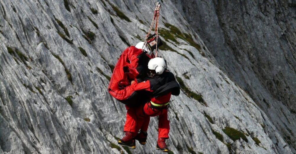 Rescue - Two People Rappelling Near Grey Rocks