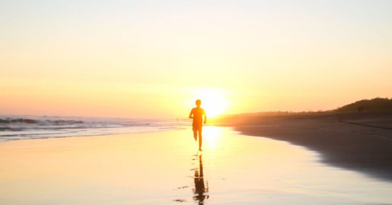 Running - Silhouette of Boy Running in Body of Water during Sunset